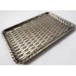 A heavy rectangular silver plated trinket tray of basket weave form, 23cm wide (approx. 630g)