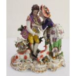 A hand-decorated late 19th / early 20th century Naples porcelain figure group - the female receiving