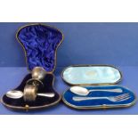 Two cased hallmarked silver sets: 1. an egg-cup, spoon and napkin-ring set - the egg cup with