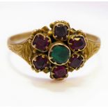 An early 19th century gem-set and yellow gold cluster ring, the central emerald with a surround of