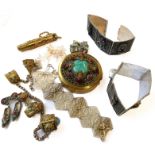 A small selection of Middle Eastern inspired jewellery including a pair of panel bracelets and a