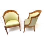 A pair of early 19th century French elm and pollard elm upholstered tub-style chairs; each with