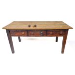 A 19th century scrubbed pine topped farmhouse kitchen-style table; the overhanging top above three