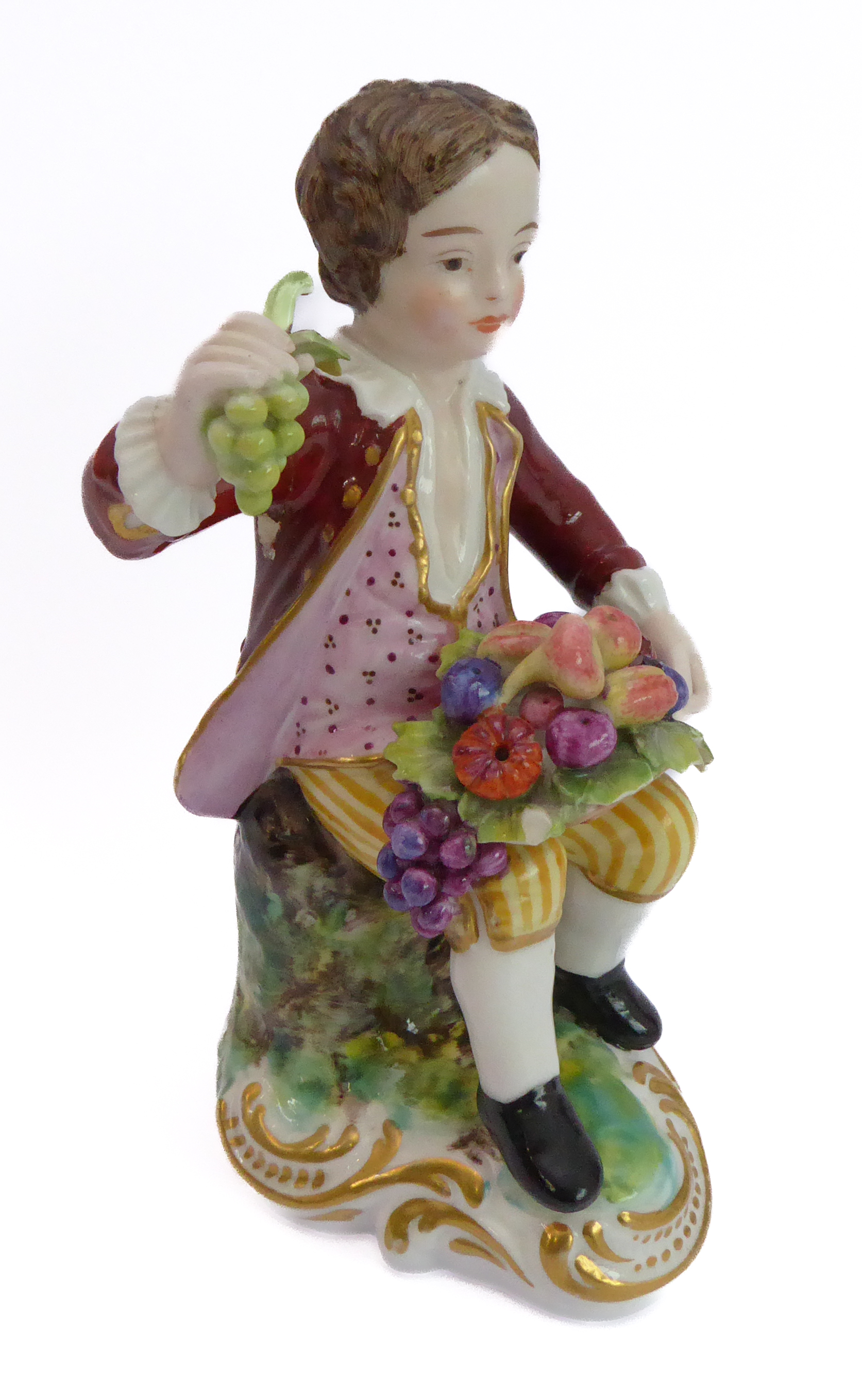 A hand-decorated Derby-style porcelain figure of a young boy - seated and holding in his right - Image 2 of 3