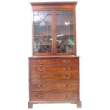 A fine and large mid/late 18th century mahogany secretaire bookcase; the outset cornice above two
