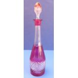 An elongated mallet-shaped red flash-cut and cut clear-glass decanter and stopper (shield-shaped