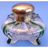 A late 19th century clear-glass inkwell of squat ovoid form -  four green glass highlights