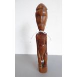 A small polished wood Indonesian figure (26cm high)