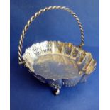 A heavy hallmarked silver cake basket – rope-twist-style swing-handle above a castellated-style
