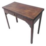 An 18th century Chippendale period foldover-top mahogany card table; the moulded edge carved with