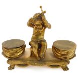 A large and heavy early 19th century ormolu double inkwell (probably French) - seated winged central