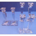 Three pairs of heavy clear-glass table candlesticks (the largest pair 25cm high)