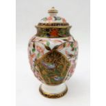 A small 19th century Crown Derby porcelain vase-and-cover decorated in the Imari pattern (13cm