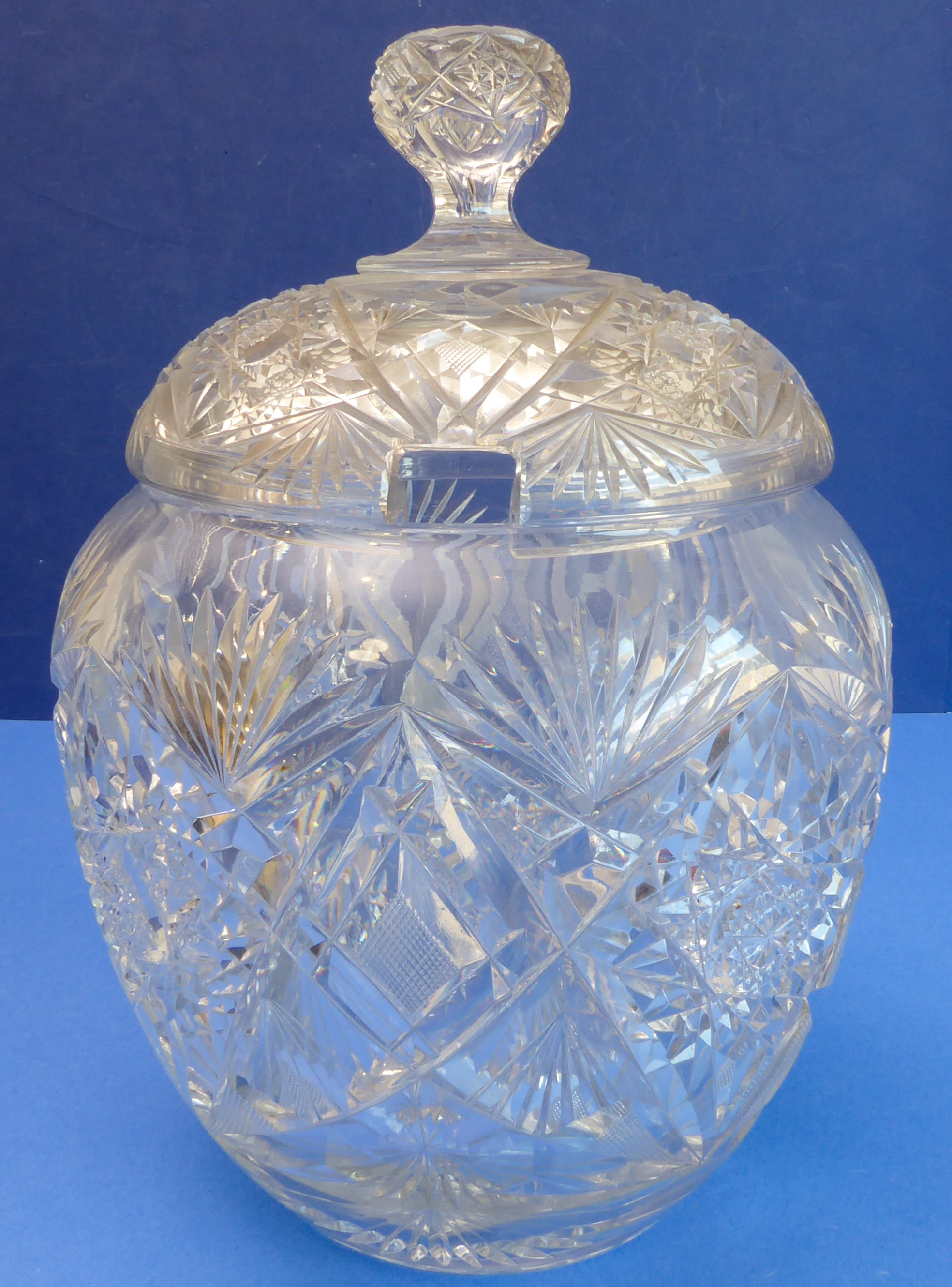 A large and heavy mid-19th century hand-cut Bohemian-style clear glass punch bowl of barrel form (