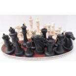 An oversized chess set (weighted), the King pieces 21cm tall