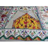 A good and interesting selection of hand-sewn Indian wall hangings, torans and fabrics etc. to