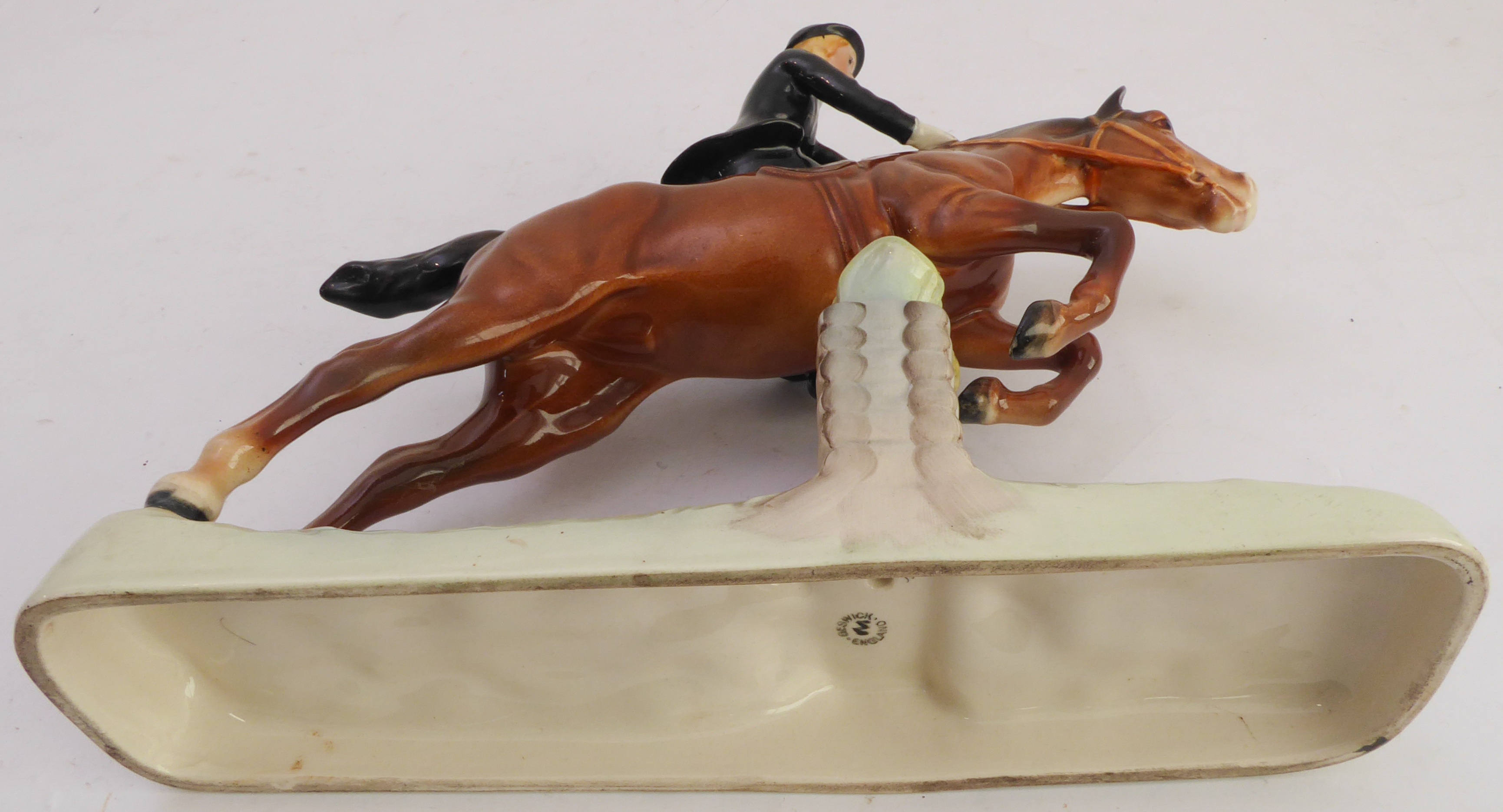 A hand-decorated Beswick model of a lady jumping a six-log fence side-saddle - printed and painted - Image 5 of 5