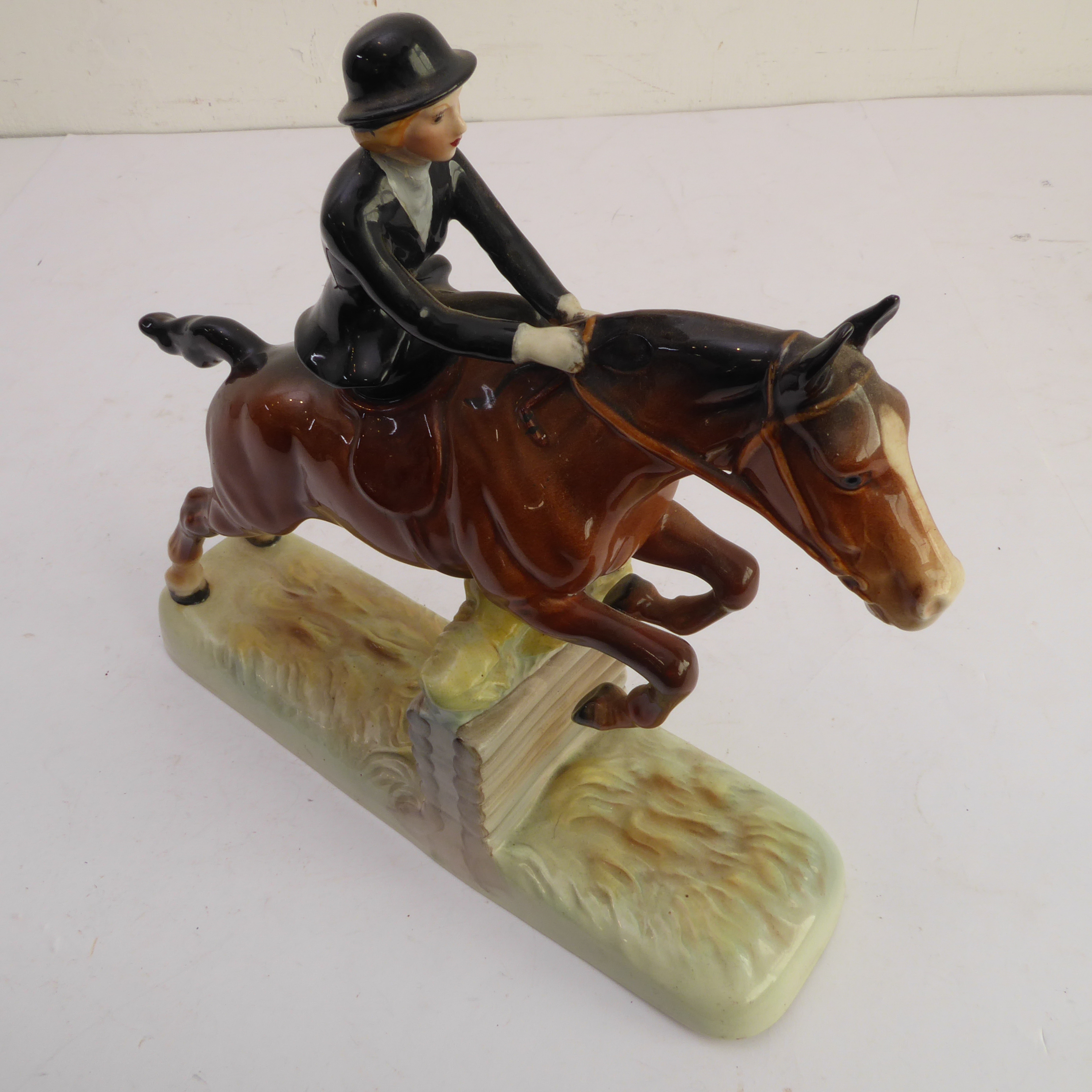 A hand-decorated Beswick model of a lady jumping a six-log fence side-saddle - printed and painted - Image 4 of 5