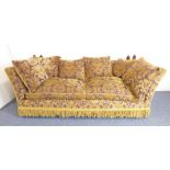 A large Knowle-style sofa luxuriously upholstered in the Renaissance style with mustard-coloured