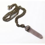 A silver-mounted tapering hexagonal quartz pendant upon a silver chain (approx. 40cm) (boxed)