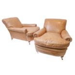 A good pair of modern club chairs in late 19th century style: beige distressed-effect leather