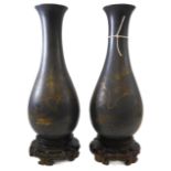 A pair of early 20th century papier-mâché vases on shaped wooden stands – probably Japanese,