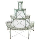 A 19th century bow-fronted and painted four tier wirework conservatory plant stand on four