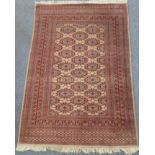A modern Pakistan wool rug with turkeman gul design on an ivory ground within multiple borders (