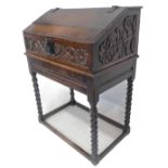 A 17th century darkly patinated oak bible box; the two exposed blacksmith made iron hinges