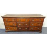 An 18th century oak Lancashire-style chest - the slightly overhanging moulded top above an