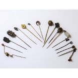 Sixteen assorted stick pins, mostly Victorian, some mounted in yellow gold including a yellow gold