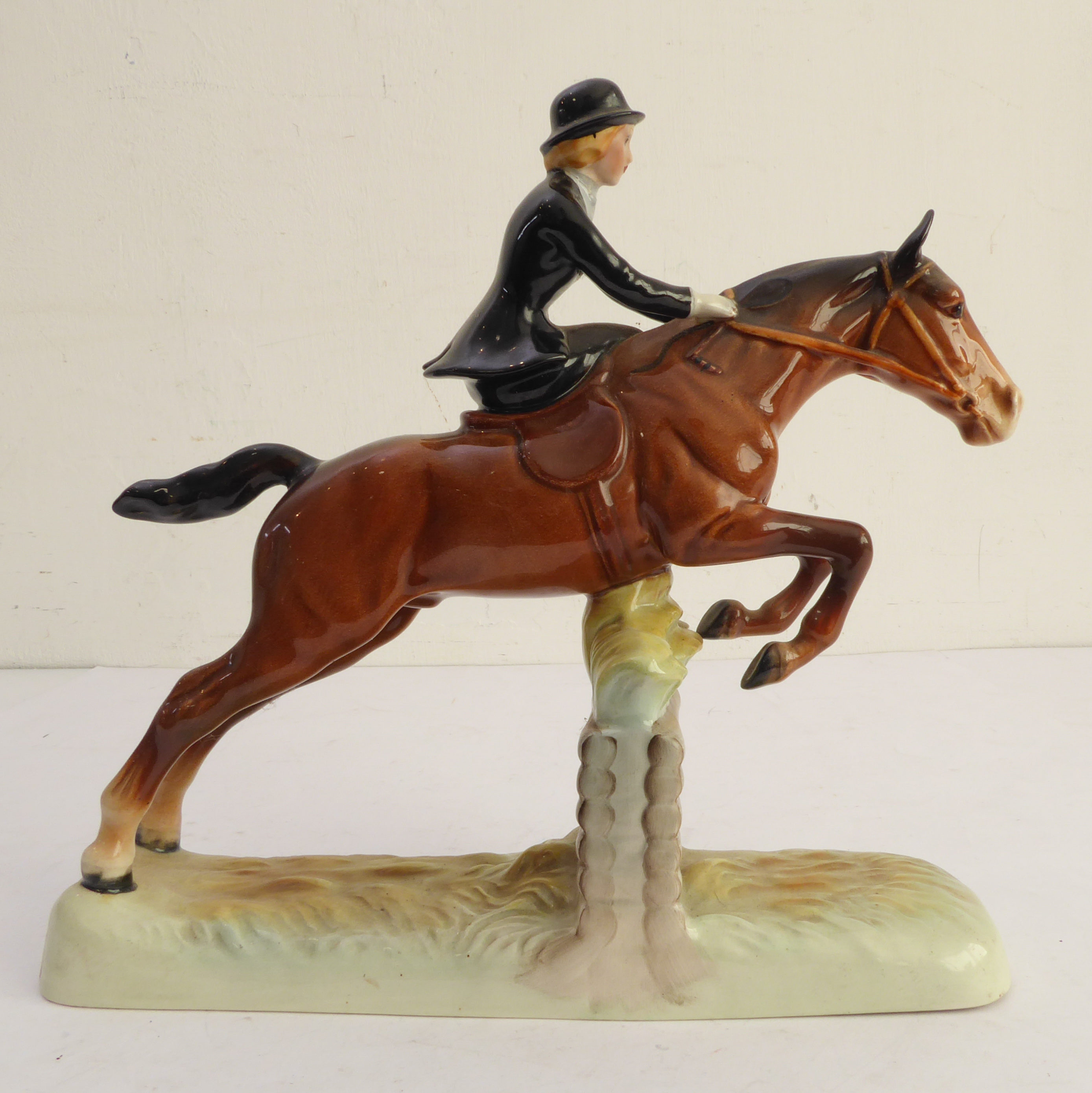 A hand-decorated Beswick model of a lady jumping a six-log fence side-saddle - printed and painted - Image 2 of 5