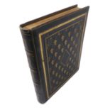 An early 20th century green leather-bound photograph album with gilt highlights containing a variety