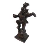 A darkly patinated heavily cast bronze model of a dancing Krishna holding butterball, Tamil Nadu,
