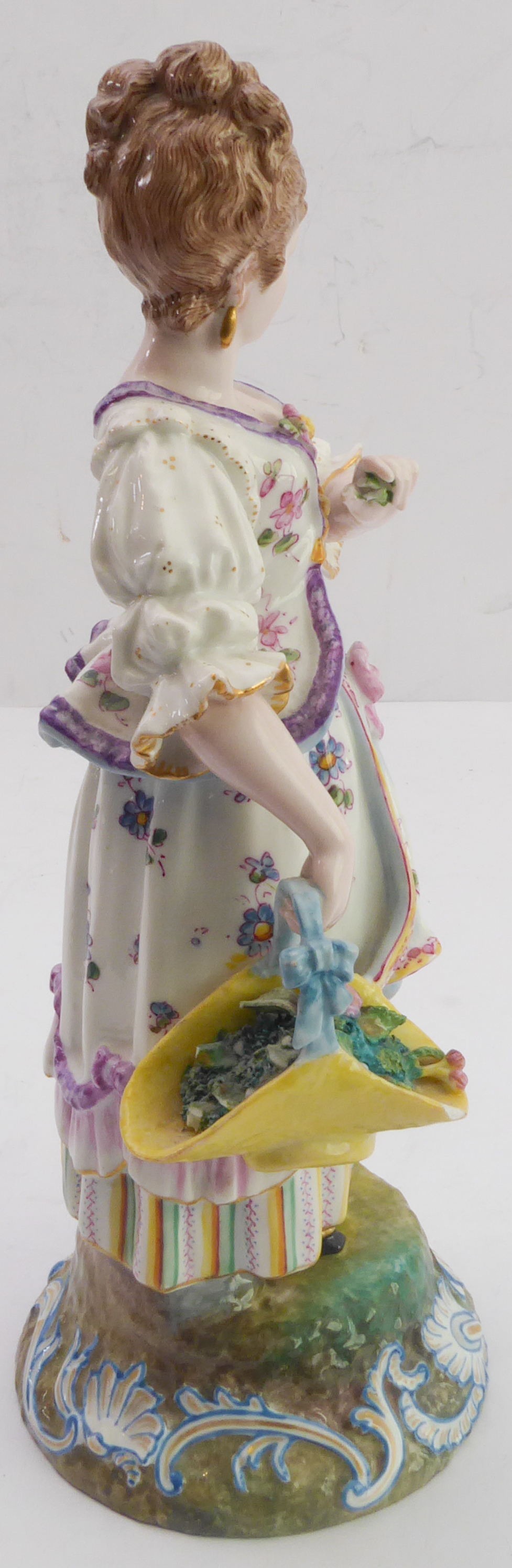 A late 19th century continental hand-decorated porcelain figure model; female with waistcoat and - Image 4 of 5