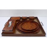 A selection of modern bird's eye wood and amboyna treen items to include a graduated set of three