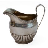 A hallmarked 19th century hallmarked silver jug of neo-classical inspiration, marked for Dobson,