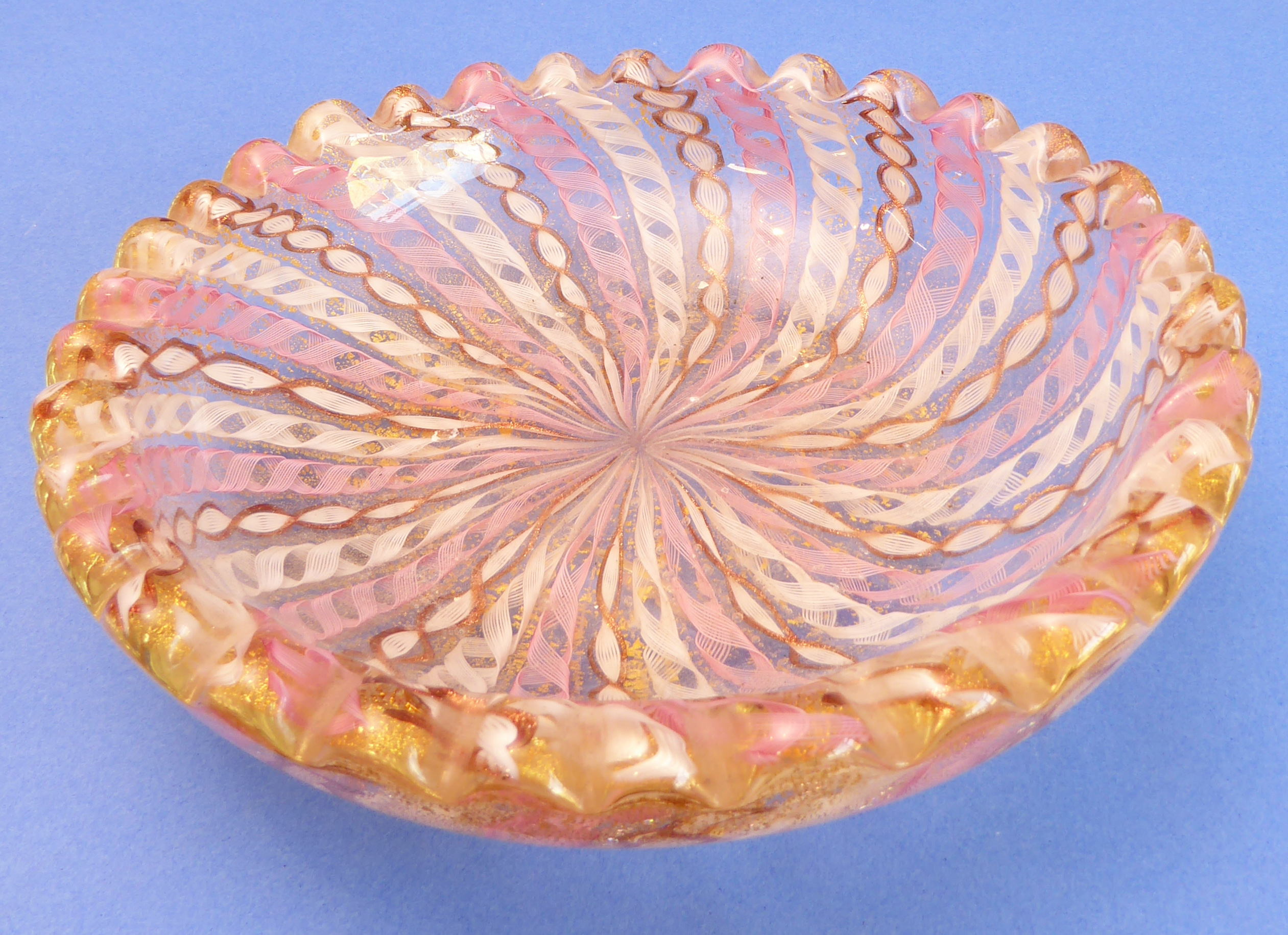 A 19th century latticinio-style heavy glass bowl decorated with alternating pink, white and husk-
