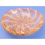 A 19th century latticinio-style heavy glass bowl decorated with alternating pink, white and husk-