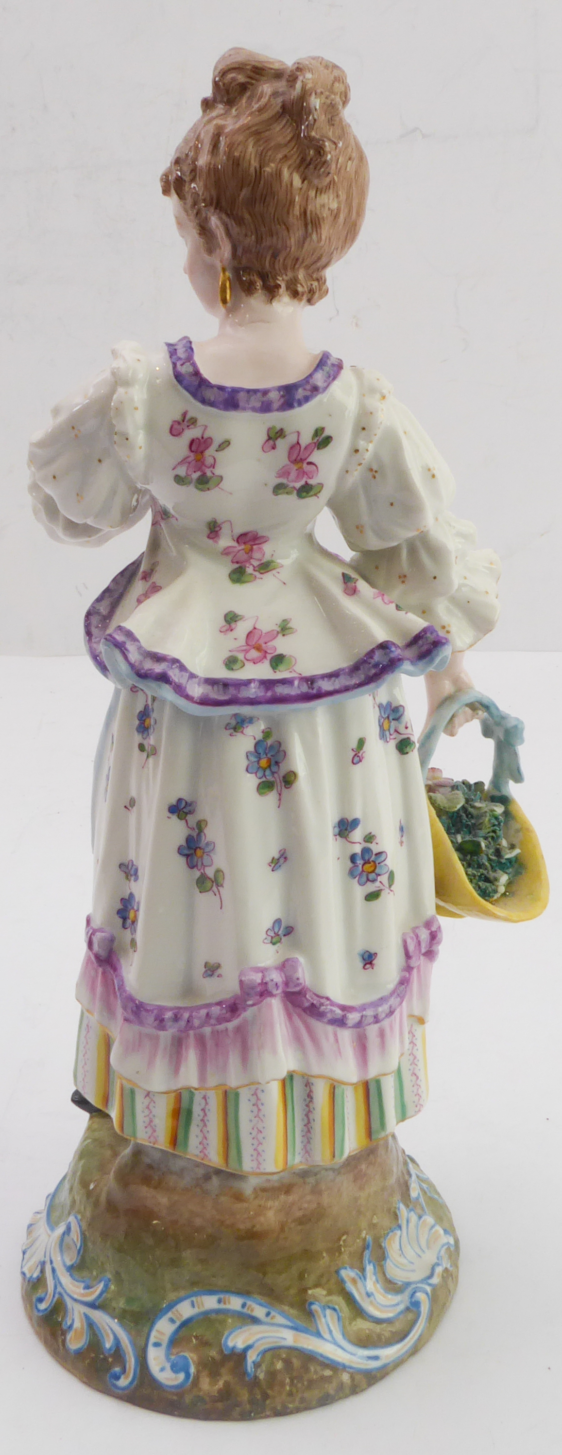 A late 19th century continental hand-decorated porcelain figure model; female with waistcoat and - Image 3 of 5