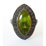 An 18-carat gold, peridot and diamond-set cluster marquis ring