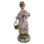 A late 19th century continental hand-decorated porcelain figure model; female with waistcoat and