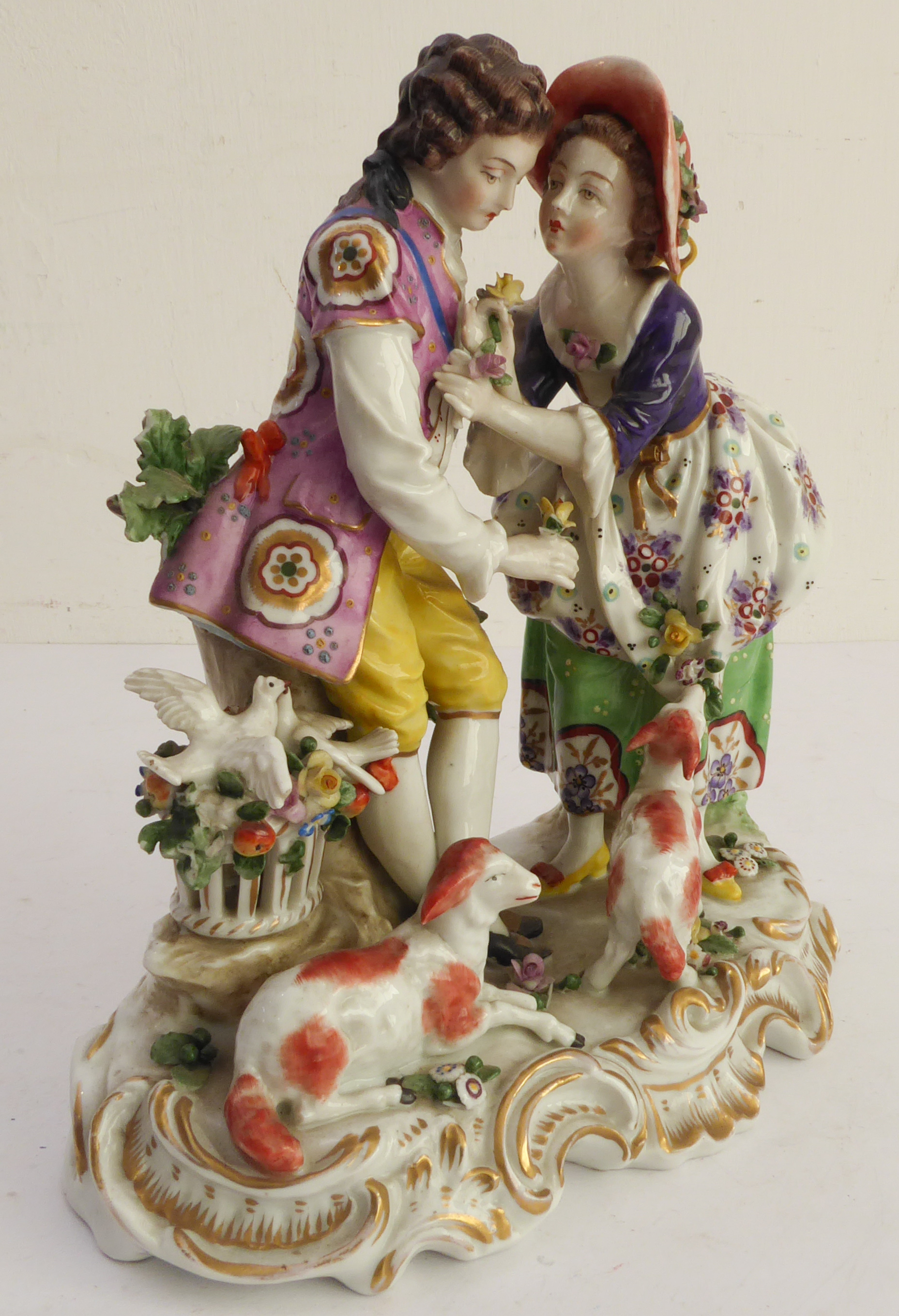 A hand-decorated late 19th / early 20th century Naples porcelain figure group - the female receiving - Image 2 of 7