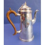 A heavy hallmarked silver coffee pot of circular conical form – high-arched scrolling wooden