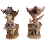 A pair of late 19th century continental porcelain hand-decorated figure models - young boy and