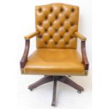 An office swivel chair in the Georgian style (late 20th century) - mustard button-back leather