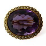 An Edwardian amethyst pearl and 15-carat yellow gold cluster brooch, the oval mixed-cut amethyst