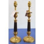 A pair of French Empire style gilt-metal candlesticks (as table lamps) (38cm high)