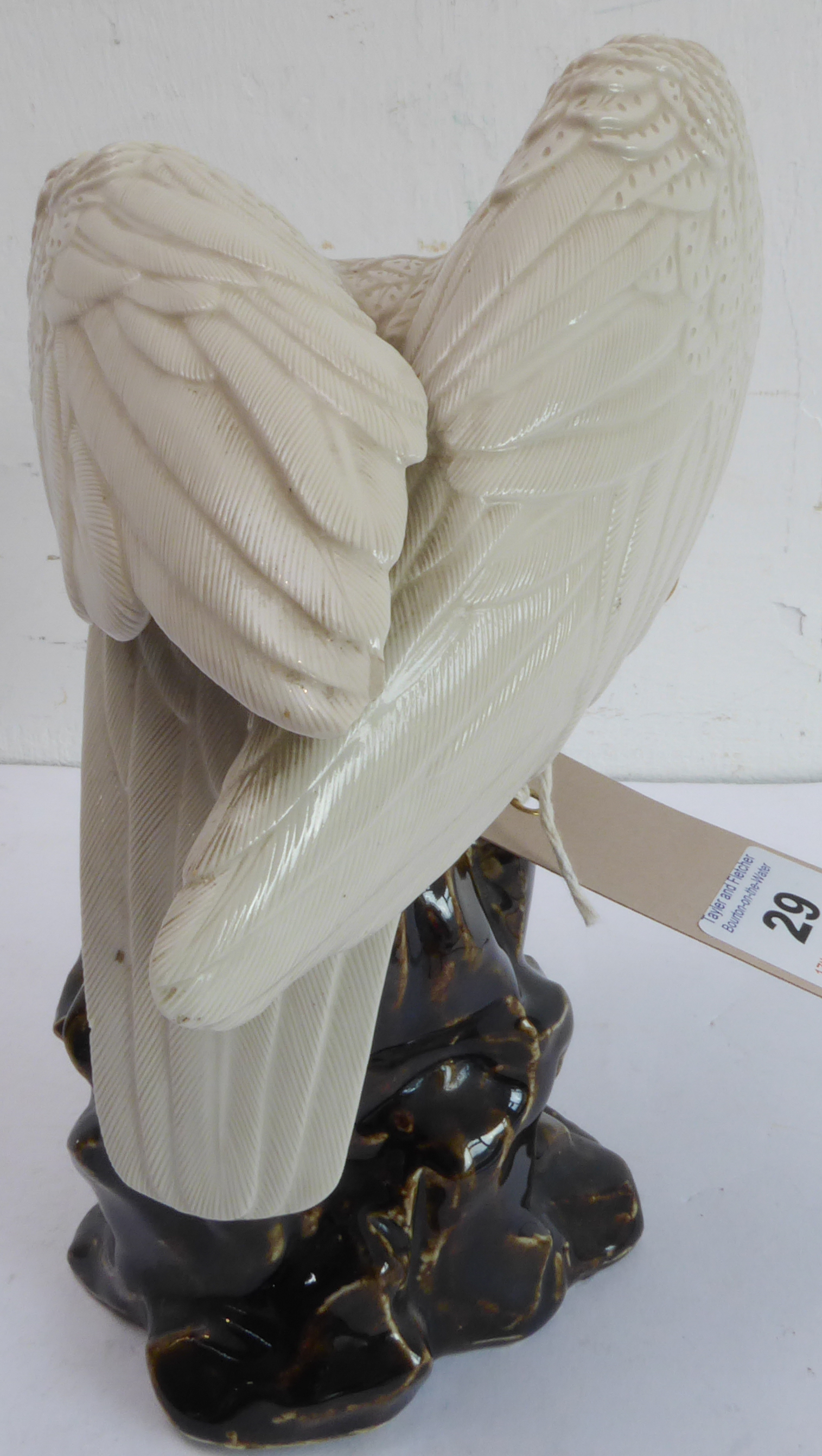 A 20th century hand-decorated porcelain model of a large white eagle perched upon rockwork (possibly - Image 3 of 4