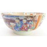 An 18th century Chinese porcelain bowl - typically hand-decorated in famille rose enamels, figures